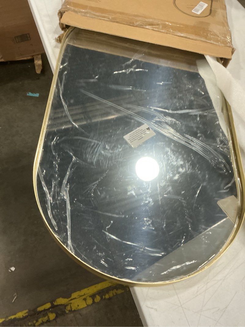 Condition photo showing Good Condition for black oval mirror, 17"x30" oval bathroom mirror, vanity mirror with brushed metal frame, wall mount mirrors decor for bathroom, bedroom, entryway, living room(hangs horizontally or vertically) black 17"l x 30"w