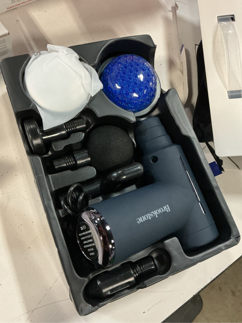Condition photo showing As Is for brookstone cordless hot and cold percussion deep tissue massager gun, 6 intensity levels