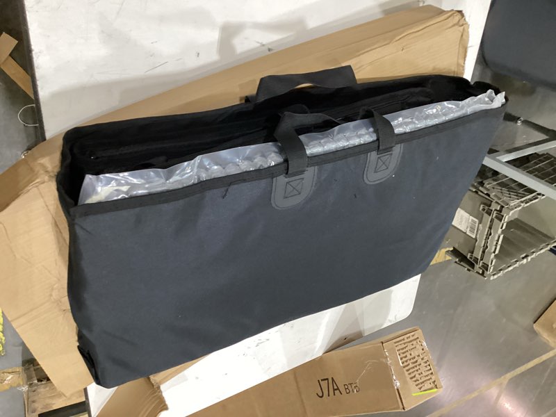 This black MasterTop soft top window storage bag features durable handles and is designed for Jeep Wranglers