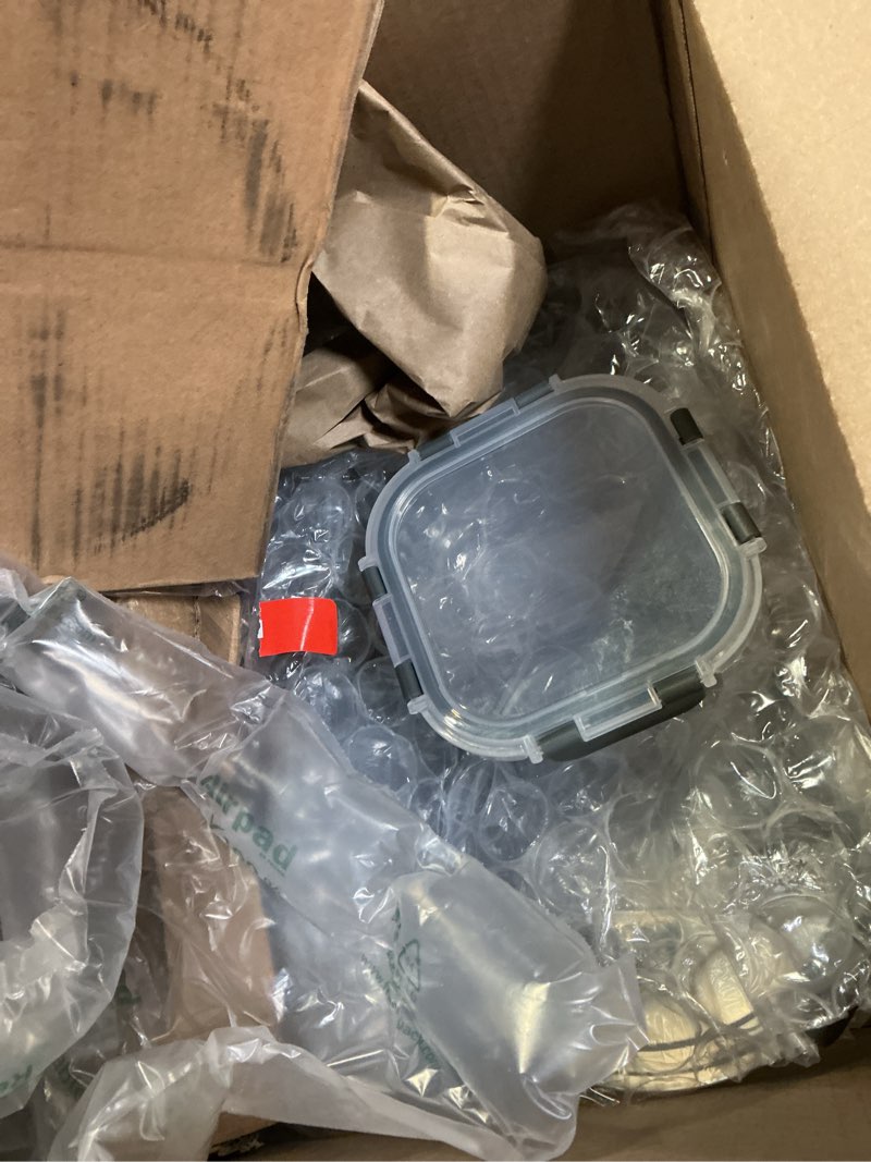 Condition photo showing As Is for KOMUEE 24 Pieces Glass Food Storage Containers Set,Meal Prep Containers-Stackable Airtight Glass Storage Containers with lids,Freezer, Microwave, Oven Safe,Gray