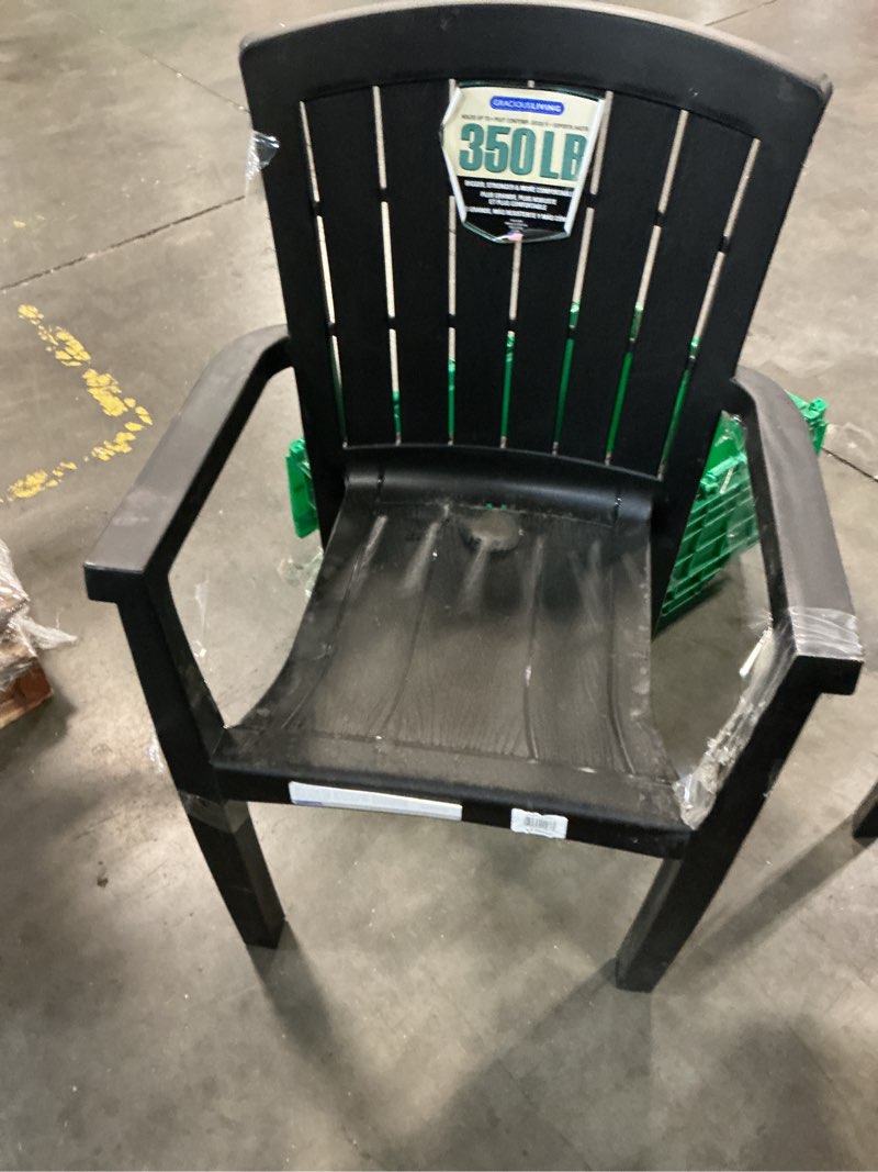 Condition photo showing As Is for black recycled plastic outdoor chair