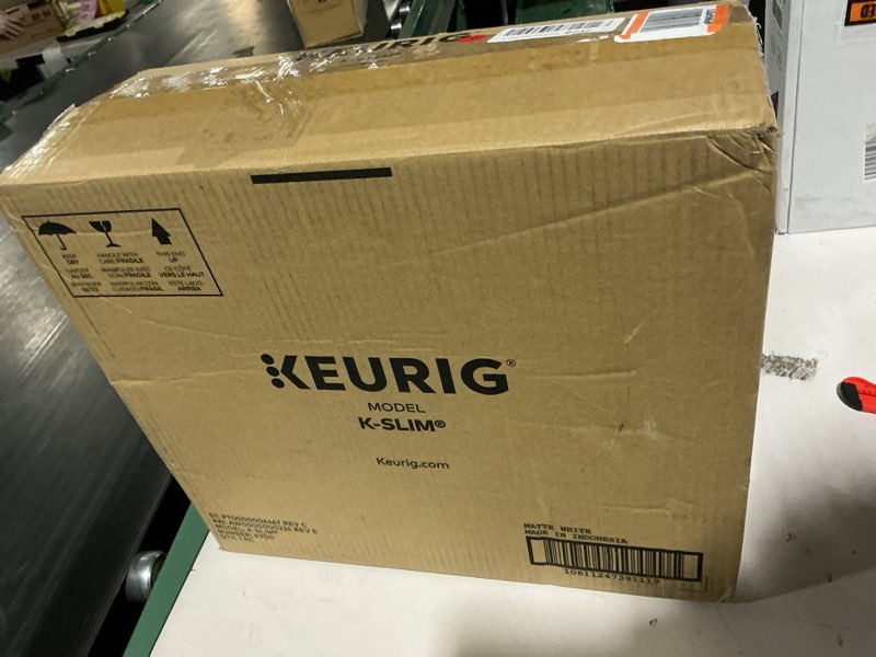 Condition photo showing As Is for keurig k-slim single serve k-cup pod coffee maker, multistream technology, 3 brew sizes, slim and sleek design, 46oz removable reservoir, white