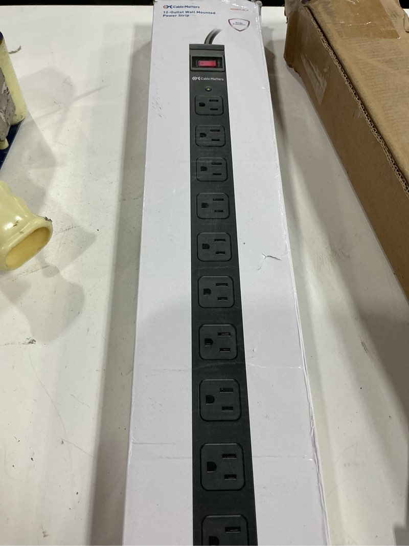 Condition photo showing Good Condition for [etl certified] cable matters wall-mountable 12 outlet power strip - 8ft cord, metal, 2100j surge protector with 15a circuit breaker, industrial power strip surge protector for garage, workshop, black 12-outlet