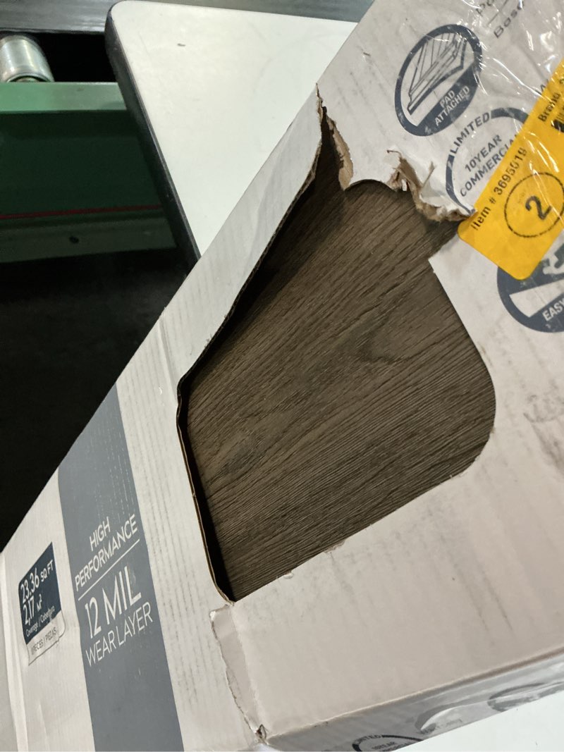 Condition photo showing Good Condition for style selections brunette oak 7-in wide x 5-mm thick waterproof interlocking luxury vinyl plank flooring (23.36-sq ft)