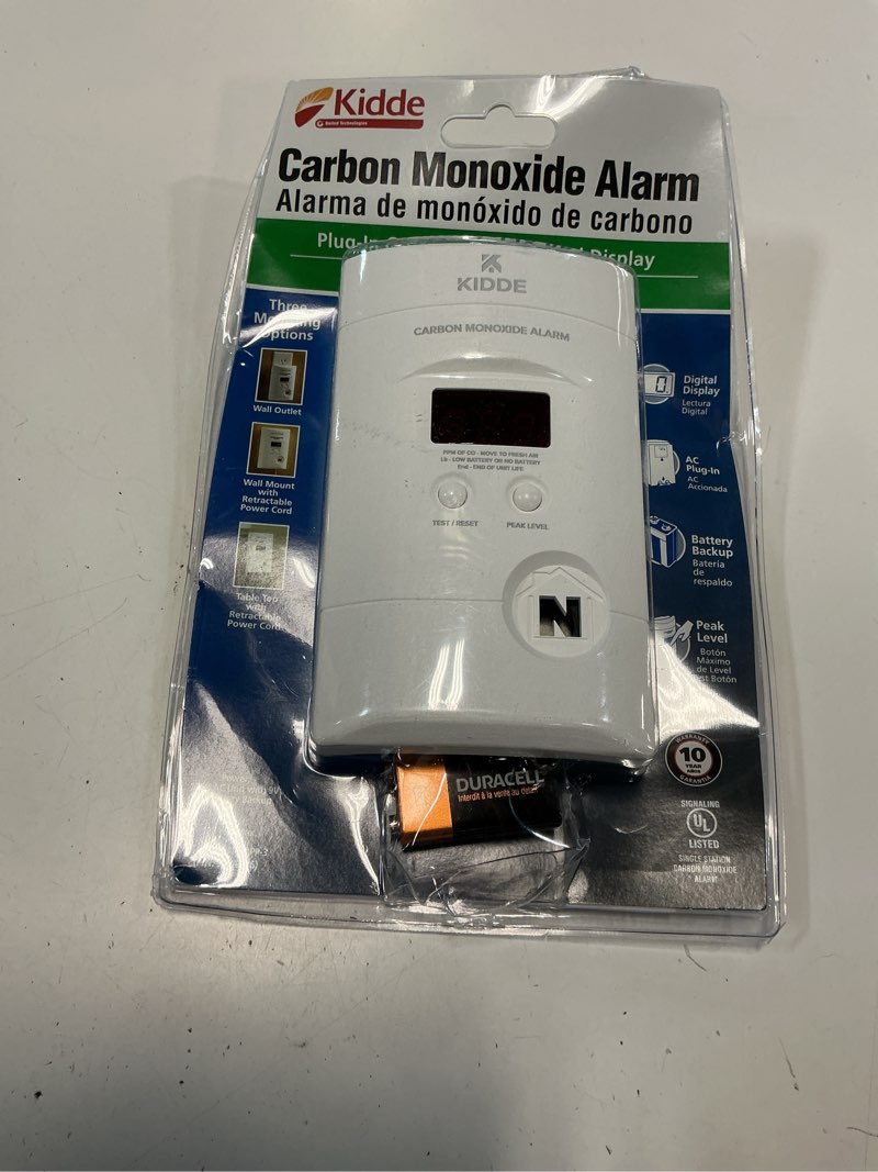 Condition photo showing As Is for kidde carbon monoxide detector, plug-in with 9v battery backup, digital display, 85 db alarm, led status light indicators, 3rd edition 1 pack 3rd edition