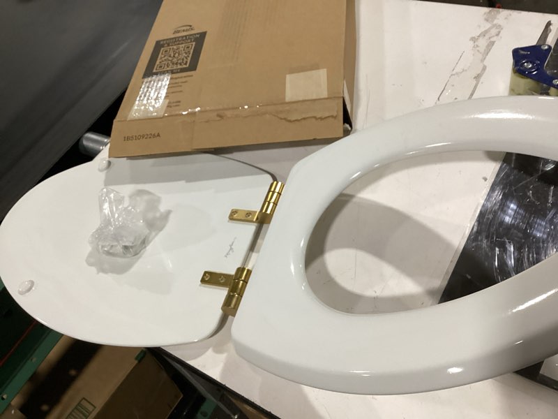 Condition photo showing As Is for mayfair bennett toilet seat with brushed gold hinges, slow close wood seat, secure metal hinges, easy install, made in usa, elongated, white elongated gold