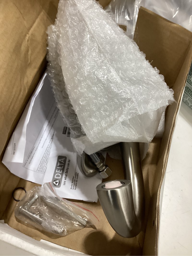 Condition photo showing As Is for delta esato brushed nickel bathroom faucet 1 hole, single hole bathroom sink faucet for vanity, push-pop drain assembly, spotshield brushed nickel 15897lf-sp spotshield stainless