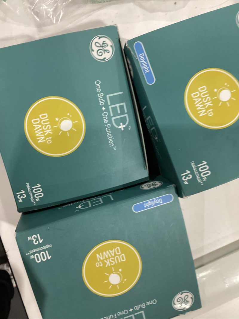 Condition photo showing Good Condition for ge led+ dusk to dawn a21 led light bulb, automatic on/off outdoor light, 13w, daylight (3 pack) 3 bulbs dusk to dawn daylight
