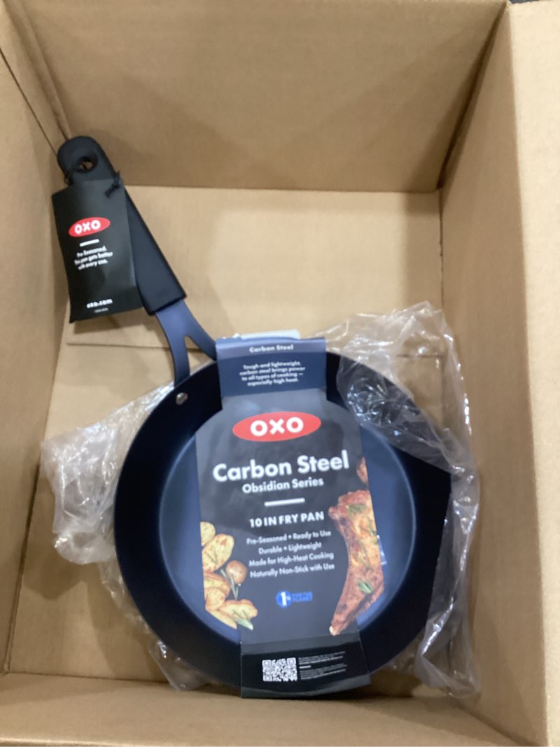 Condition photo showing New/Like New for oxo obsidian pre-seasoned carbon steel, 10" frying pan skillet with removable silicone handle holder, induction, oven safe, black