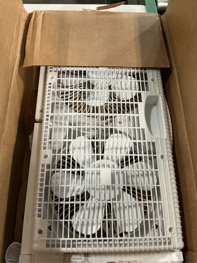 Condition photo showing As Is for comfort zone 9  3-speed reversible twin window fan with remote control  white