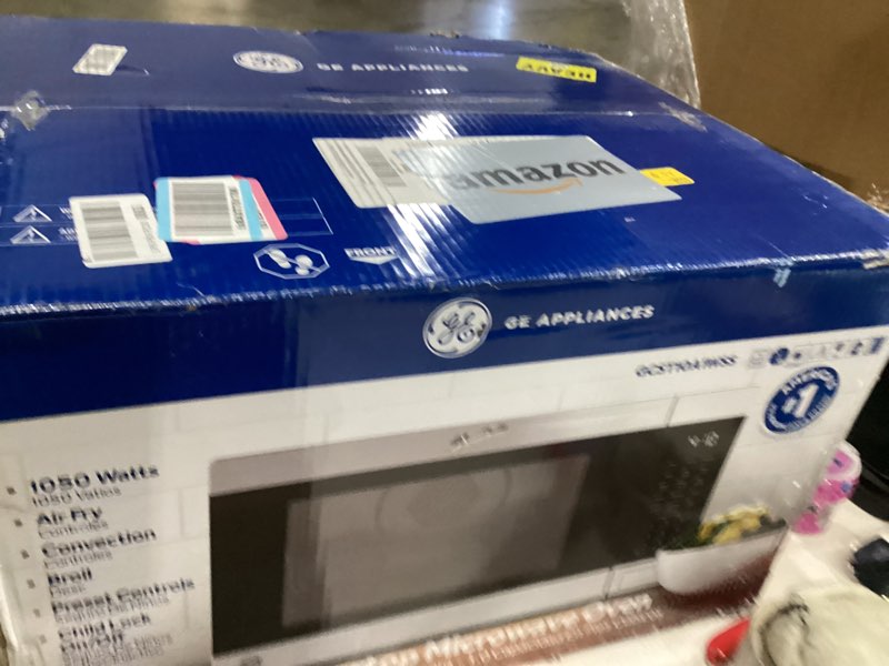 Condition photo showing New/Like New for GE GCST10A1WSS 1.0 Cu Ft Convection Microwave Oven, 1050W Countertop Air Fry Microwave with Broil & Crisper Pan, Compact Stainless Steel Design