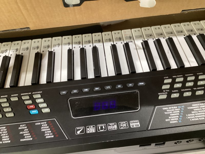 Condition photo showing As Is for RockJam 61 Key Keyboard Piano with Pitch Bend, Power Supply, Sheet Music Stand, Piano Note Stickers & Simply Piano Lessons Modern, NOT TESTED