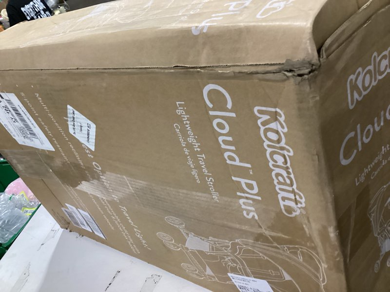 Condition photo showing New/Like New for kolcraft cloud plus lightweight umbrella stroller for toddlers with reclining seat, large storage basket, canopy, infant & parent trays, compact fold for summer travel, durable frame, slate gray