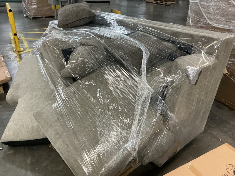 Condition photo showing As Is for Signature Design by Ashley Stonemeade Casual Right-Arm Facing Sofa Chaise with Reversible Cushion and 4 Toss Pillows, Light Brown