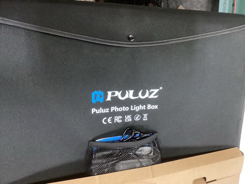 Condition photo showing New/Like New for photo box, puluz 24"x24" photo studio light box for photography portable large lightbox photo booth kit with 6 colors photo backdrops-dimmable 120pcs led beads, 5500k lighting, us plug