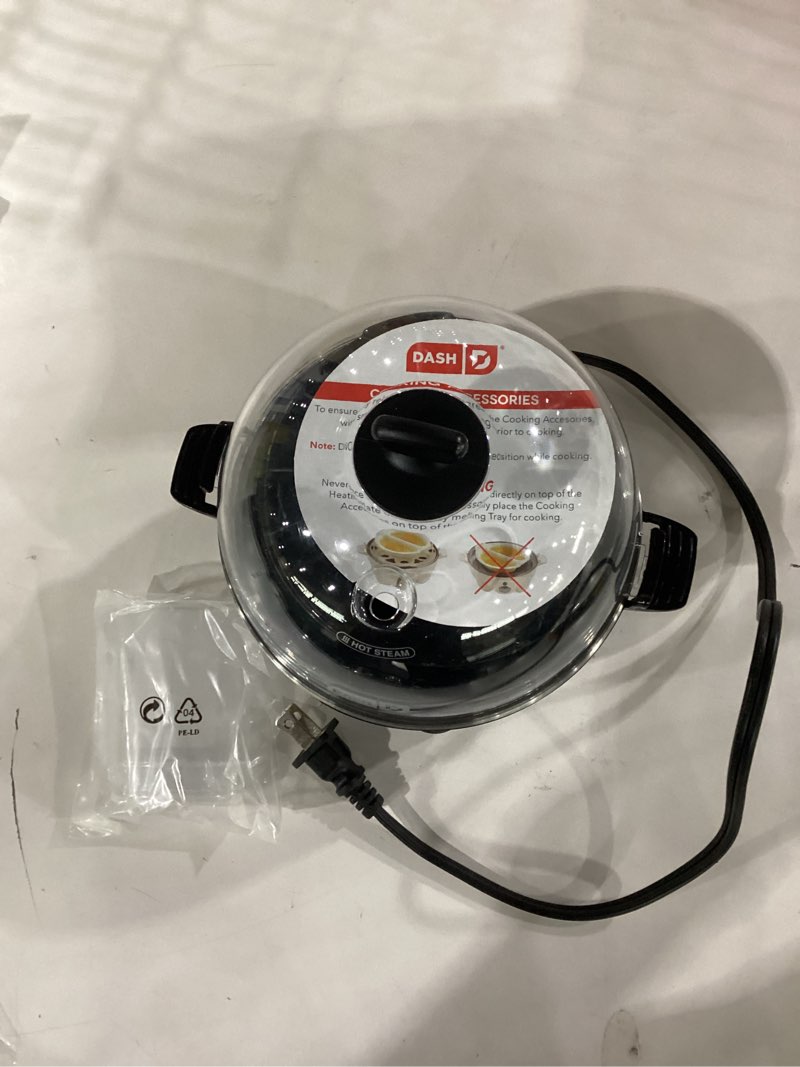 Condition photo showing As Is for dash rapid egg cooker - boiler, poacher & steamer - includes measuring & recipe guide - dishwasher safe - bpa free - holds 7 eggs, black 7 eggs black