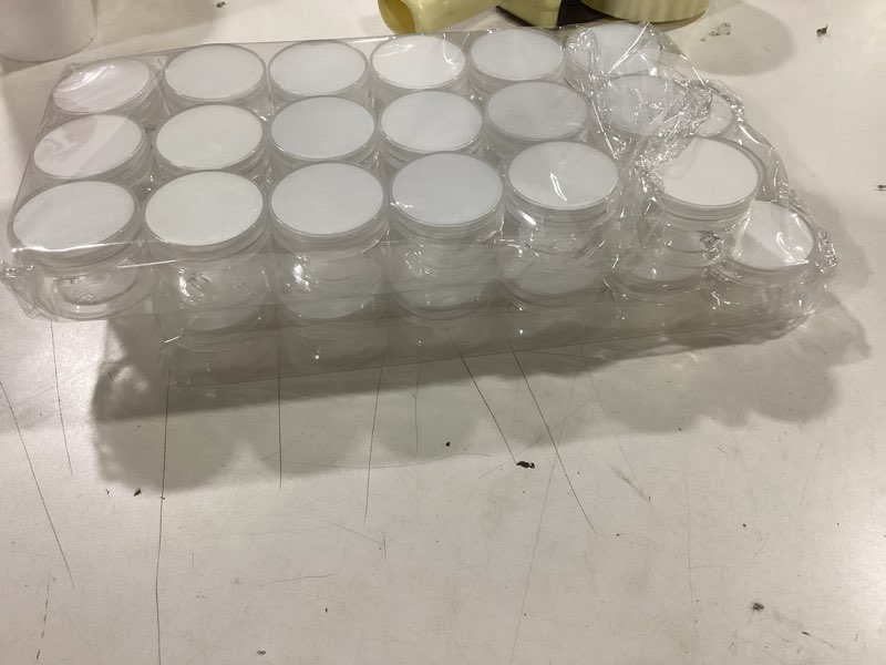 Condition photo showing Good Condition for 36 Pack 1 OZ Plastic Jars with Lids, BPA Free, Reusable, Refillable Transparent Cosmetic Containers for Bath Salts, Cosmetics, Powders, Beauty Product and Small Accessories, White 1 Ounce White