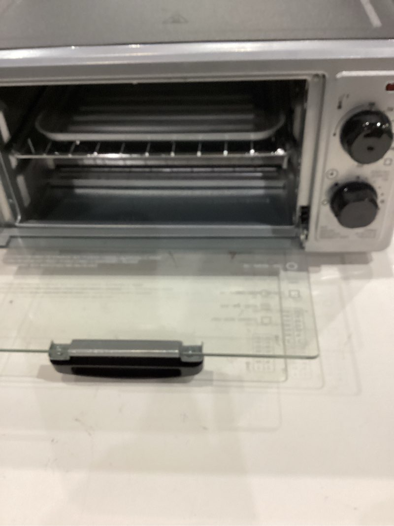 Condition photo showing Good Condition for proctor silex 4 slice countertop toaster oven, multi-function with bake, toast and broiler, 1100 watts, 30 min timer and auto-shutoff, includes backing pan and rack, black and silver (31260)