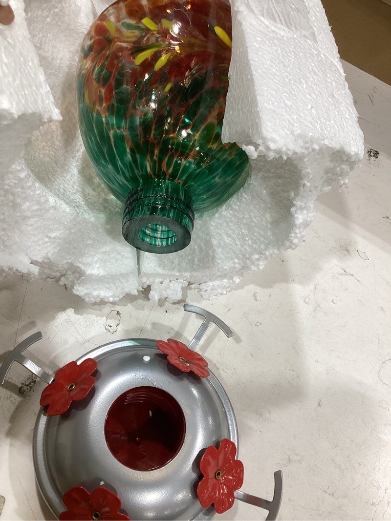 Condition photo showing As Is for rezipo hummingbird feeder with perch - hand blown glass - 38 fluid ounces hummingbird nectar capacity include hanging wires and moat hook (green)