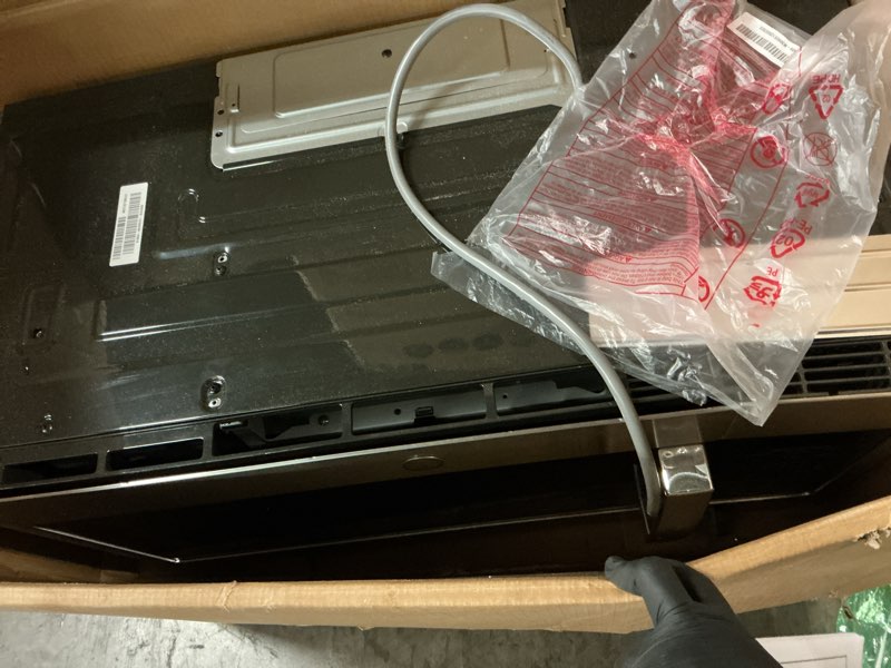 Condition photo showing Good Condition for 30 in. over-the-range microwave in stainless steel with dishwasher safe grease filter and vent
