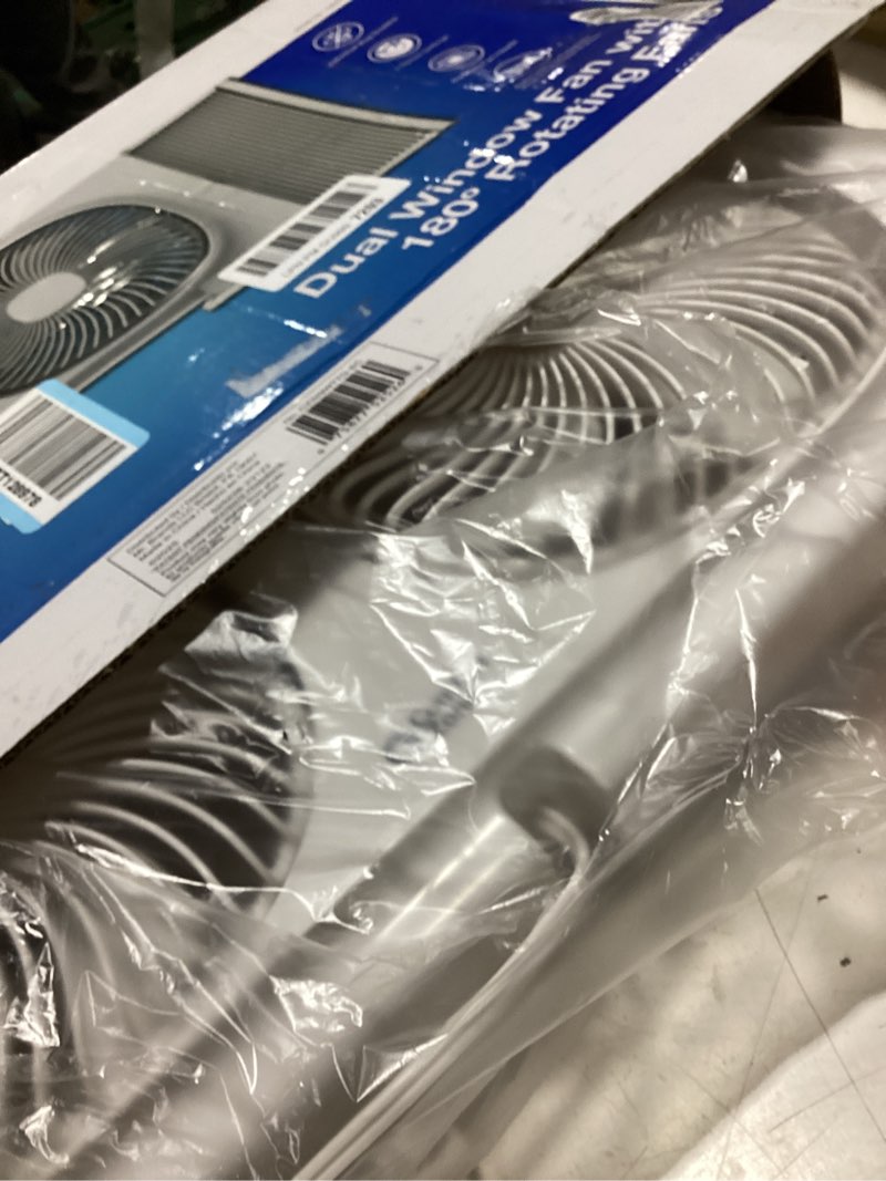 Condition photo showing As Is for comfort zone 9-inch twin window fan with 2-speed independent 180° rotating fan heads, auto-locking expanders & removable bug screen, for fresh air intake or warm air exhaust, ideal for home & office modern