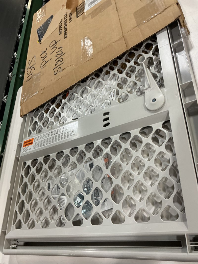 Condition photo showing Good Condition for mypet universal pet gate: 26” - 42” wide dog gate for doorways with pressure fit or swinging door hardware mounting types included: 26" tall; gray