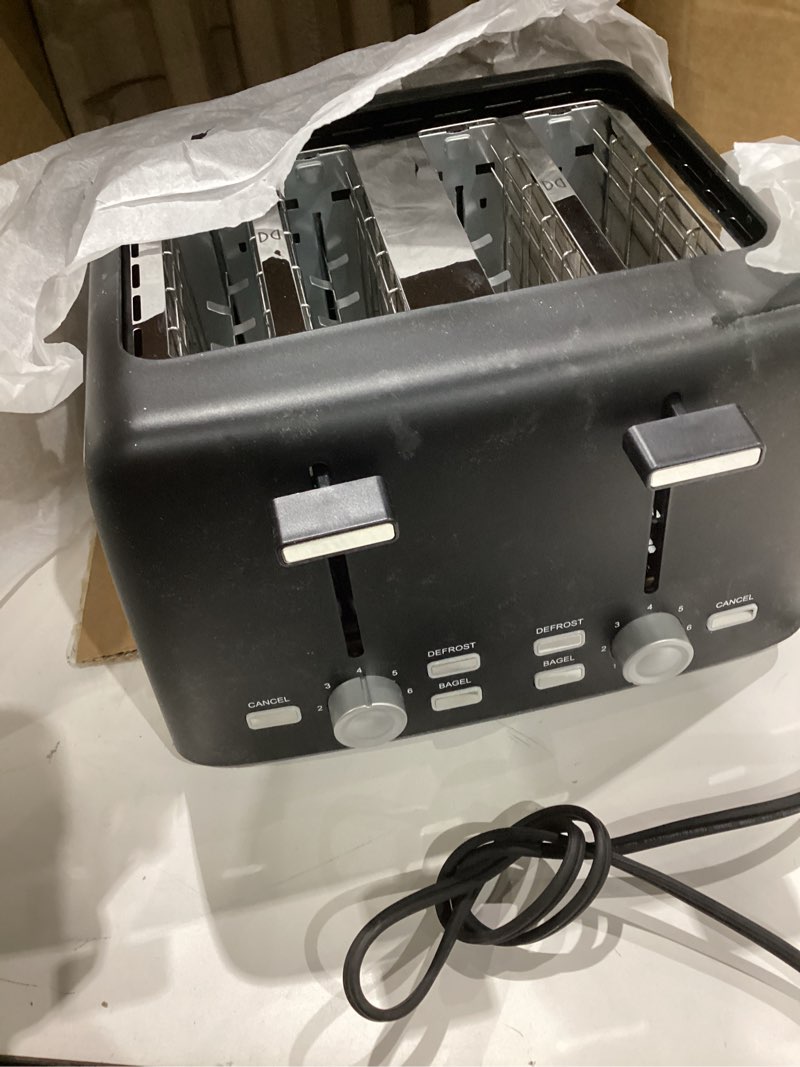Condition photo showing Good Condition for amazon basics 4 slice toaster, with 7 browning settings, extra wide slots for bagels and special breads, removable easy-to-clean crumb trays, cancel/defrost/bagel buttons, 1500w, black & silver