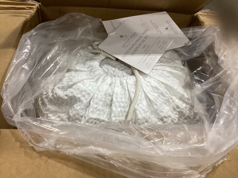 Condition photo showing Good Condition for levtex home cloud waffle twin/twin xl comforter set (68x88in) with 1 pillow sham (26x20in) - solid waffle cotton texture - bright white - 100% cotton twin size comforter set - soft, pre-washed twin/twin xl comforter bright white