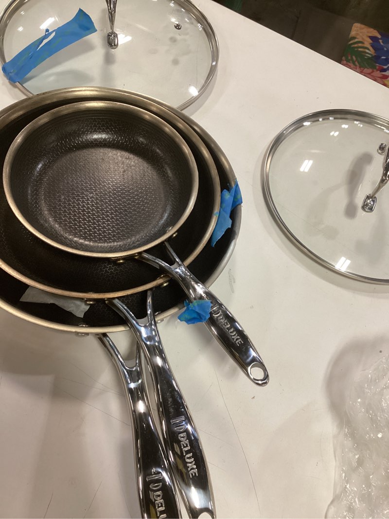 Condition photo showing As Is for DELUXE Hybrid Nonstick Fry Pan Set 5-Piece, 8, 10 and 12-Inch Frying Pan Cookware Set with Glass Lids, Skillet with Stay-Cool Handles, Dishwasher&Oven Safe, Compatible with All Cooktops