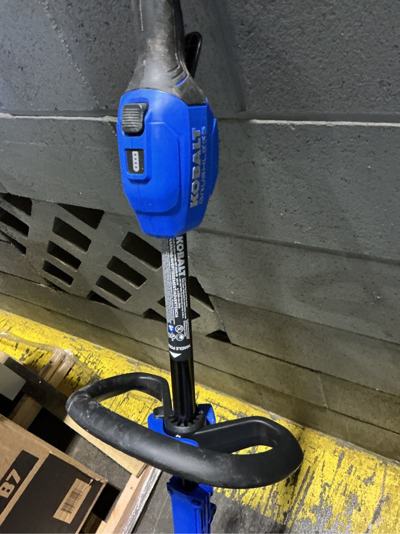 Condition photo showing As Is for kobalt quiet tech 24-volt 15-in straight shaft battery string trimmer