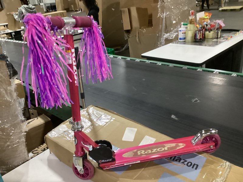 Condition photo showing As Is for razor a5 lux kick scooter for kids ages 8+ - 8" urethane wheels, anodized finish featuring bold colors and graphics, for riders up to 220 lbs pink scooter