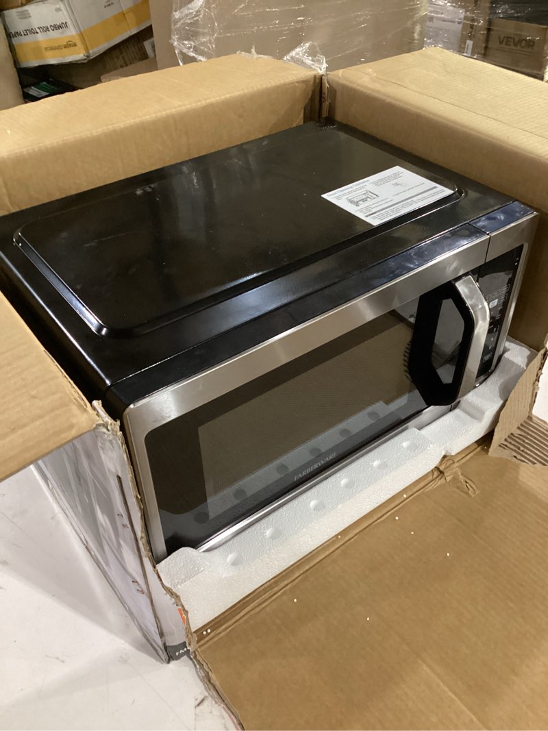 Condition photo showing As Is for farberware 0.7 cu. ft. countertop microwave oven – 700 watts power, auto cook settings, defrost, easy clean and child safety lock - stainless 0.7 cu. ft. stainless steel