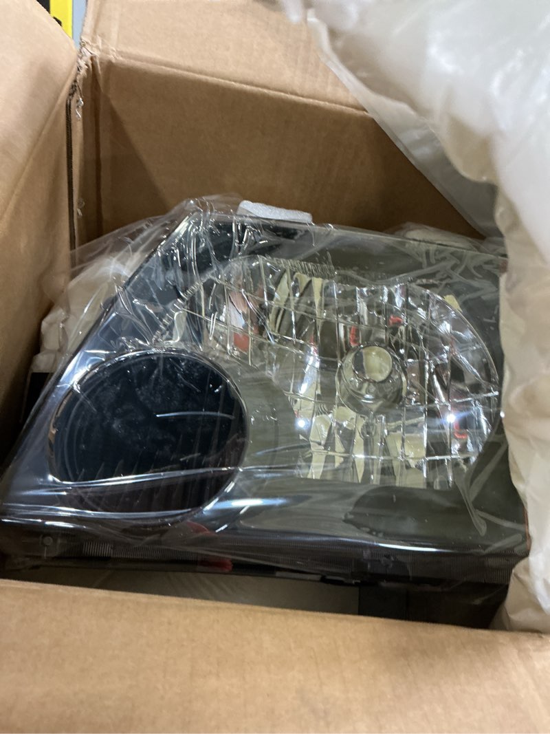Condition photo showing New/Like New for headlight assembly pair compatible with nissan xterra 2005-2015, factory-oe-style halogen headlamp replacements for 26010-ea025 26060-ea025, w/o bulb, black housing clear lens yellow corner black+yellow