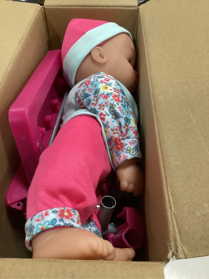Condition photo showing As Is for shopping cart with 16" baby doll