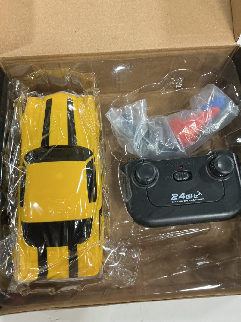 Condition photo showing New/Like New for rc drift car, 1/24 4wd remote control car 2.4ghz high speed drift rc cars with led light, two rechargeable batteries and drifting tires for kids boys girls and adults, yellow