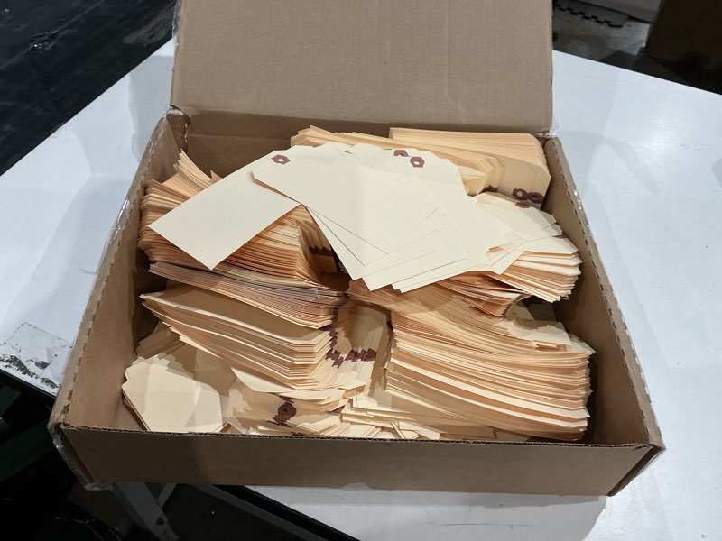 Condition photo showing As Is for aviditi 6 1/4" x 3 1/8" manila shipping tags, 10 pt. reinforced eyelet, to identify or address items that cannot be labeled, case of 1000