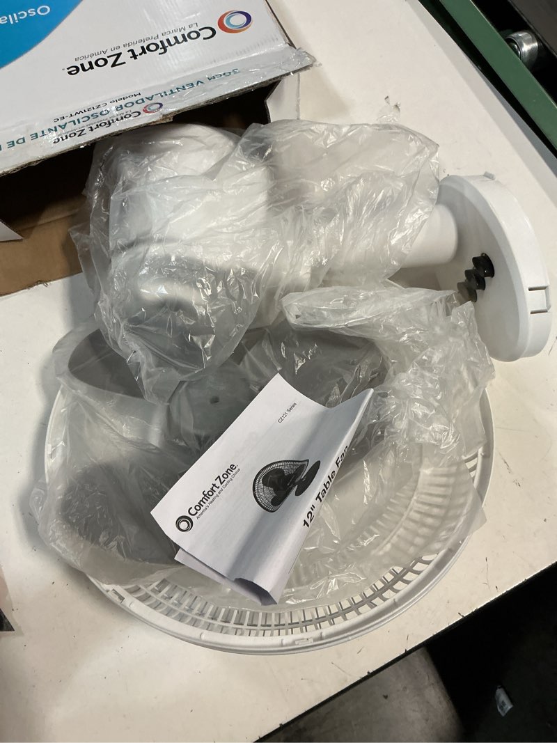Condition photo showing New/Like New for Comfort Zone Oscillating Table Fan with Adjustable Tilt, Convenient Push Button Controls, Quiet, 12 inch, 3 Speed, Desk Fan, Airflow 7.25 ft/sec, Ideal for Home, Bedroom, Dorm & Office, CZ121WT White