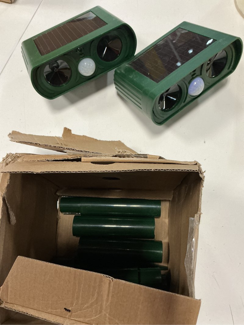 Condition photo showing As Is for 2 pack solar animal repeller with motion detection ultrasonic outdoor deer repellent device for patio garden yard waterproof animal repellent deterrent to repel cat squirrel rabbit dog raccoon skunk green 2 pack