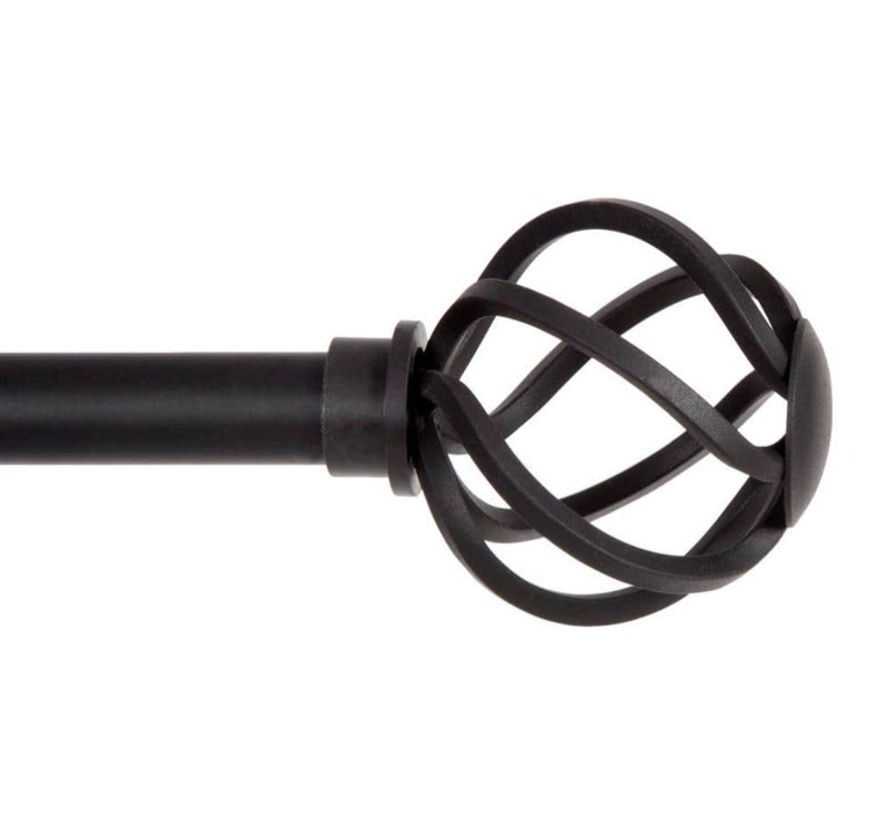  Add a touch of style to your home with the Cage 5/8" Standard Decorative Window Curtain Rod by Kenney. The 5/8 inch diameter Cage curtain rod in black features matching decorative openwork finial ends. Use in your bedroom or living room to hang light to medium weight curtains.