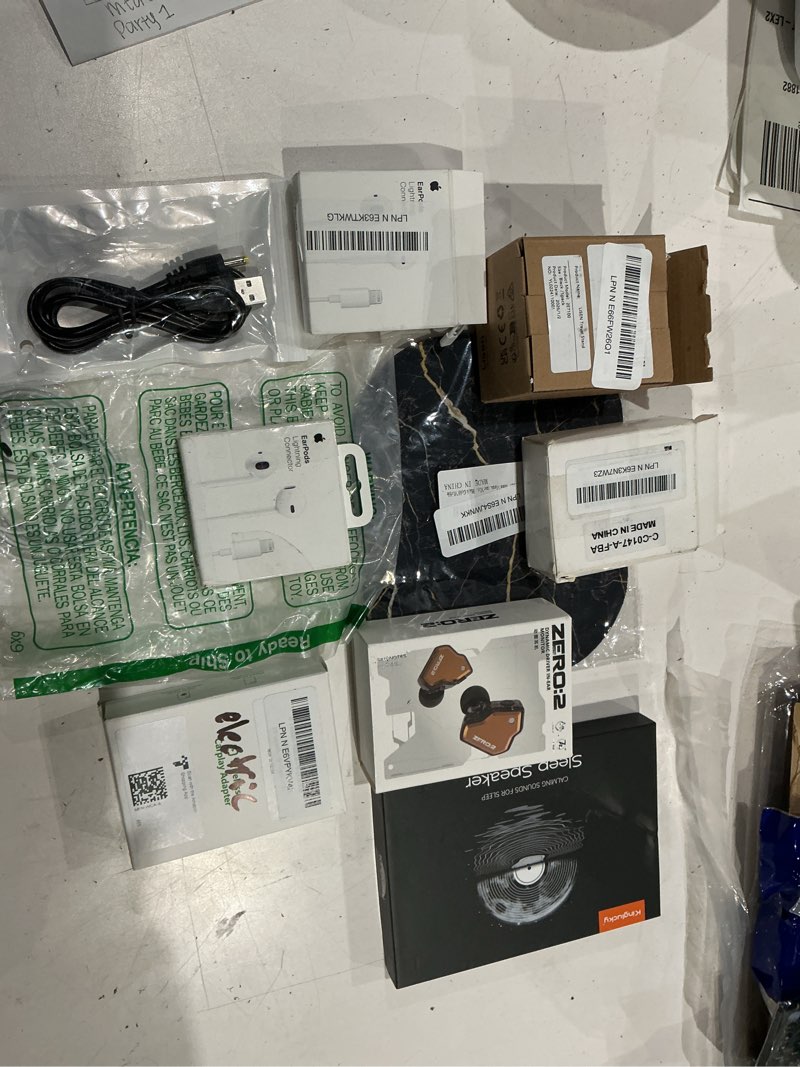 Condition photo showing As Is for assorted lot of electronics (headphones, small gadgets, headsets, etc.) 