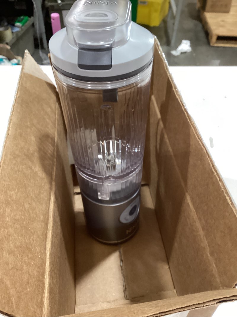 Condition photo showing As Is for ninja blast max, portable blender + twist & go, personal smoothie, blend, ice crush, 3 programs, cordless, 22 oz removable vessel, dishwasher safe, leakproof, silver, bc251sl