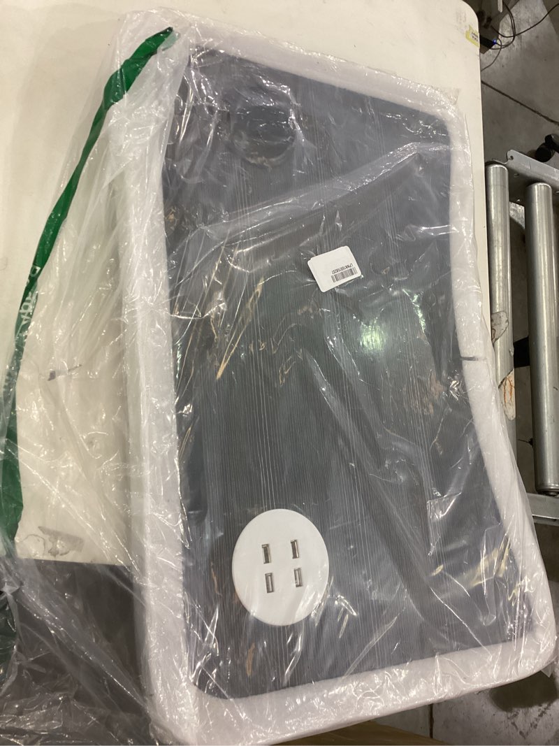 Black desk top with charger plug