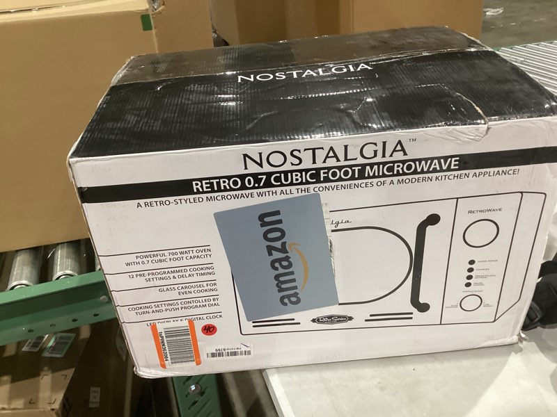 Condition photo showing Good Condition for Nostalgia Retro Compact Countertop Microwave Oven - 0.7 Cu. Ft. - 700-Watts with LED Digital Display - Child Lock - Easy Clean Interior - Orange Retro Classic 0.7 Cu. Ft. Orange