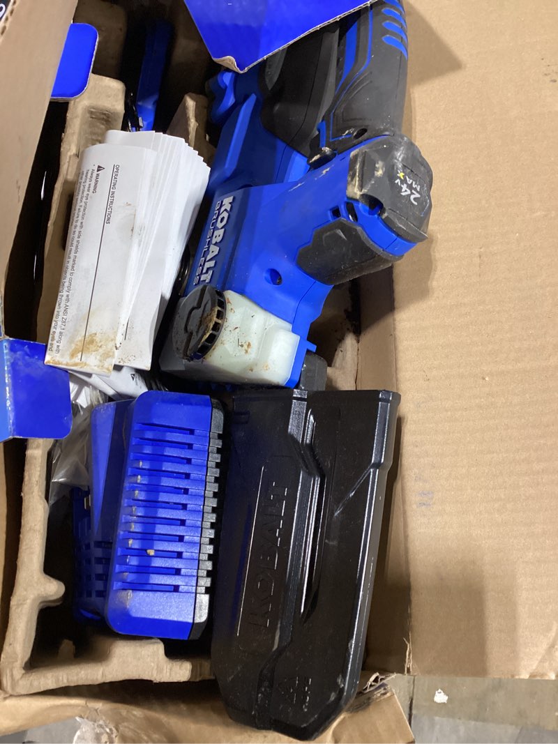 Condition photo showing As Is for kobalt 24-volt 6-in battery 2 ah chainsaw (battery and charger included)