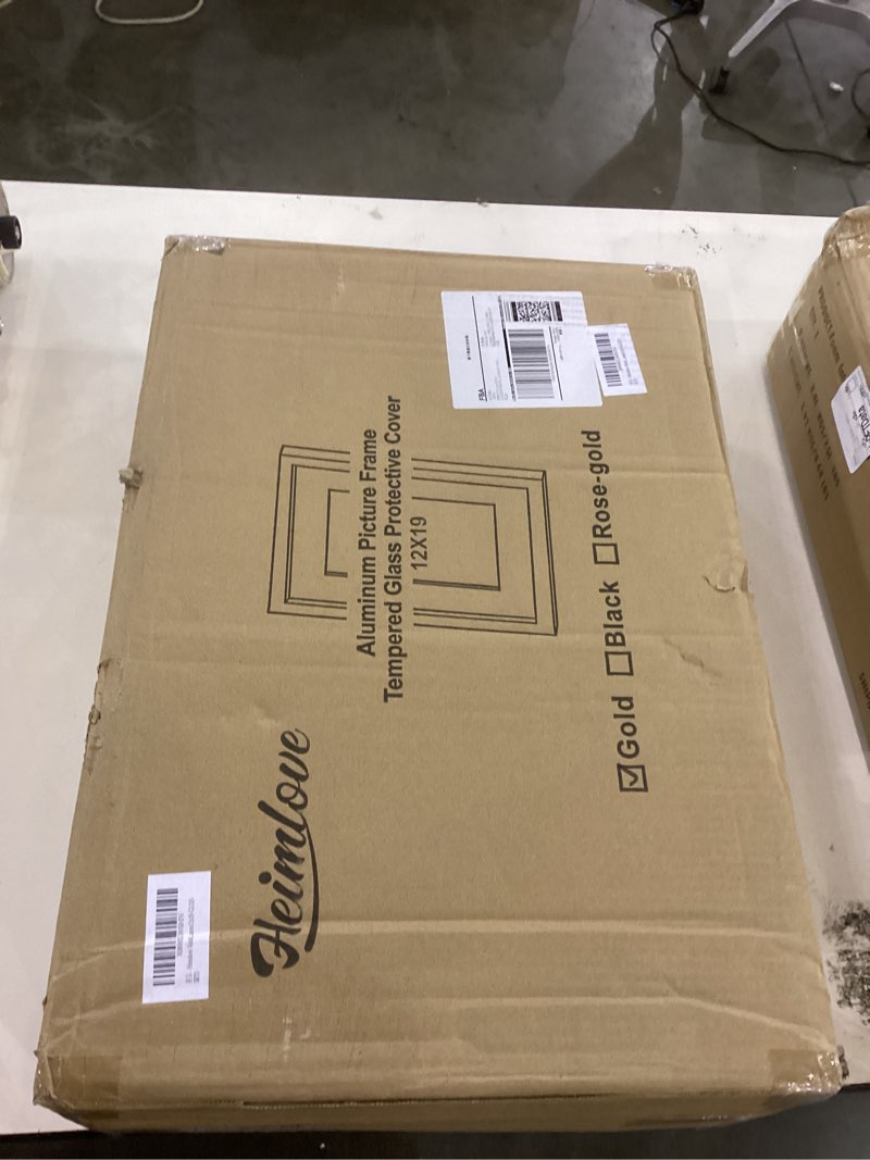 Condition photo showing New/Like New for Heimlove 12x19 Aluminum Picture Frame, Metal Picture Frame Wall Mounting Horizontally or Vertically, Photo frame with Tempered Glass - Poster Frame Simple and Elegant Decor for Wall - 3 Pack - Gold 12x19 Gold-3P