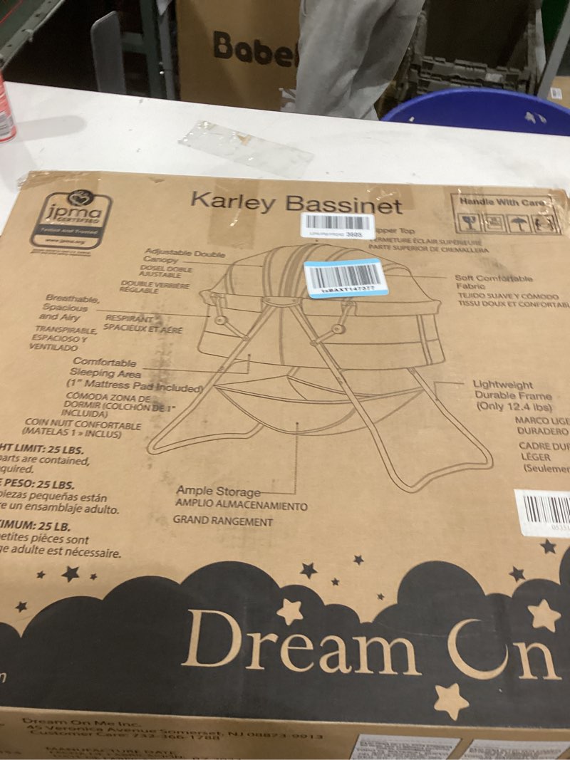 Condition photo showing As Is for Dream On Me Karley Bassinet, Award Winner Lightweight Travel Baby Bassinet, Foldable Bedside Sleeper, Adjustable Double Canopy, Spacious Design, Soft Fabric, Storage Basket – Blue and Grey