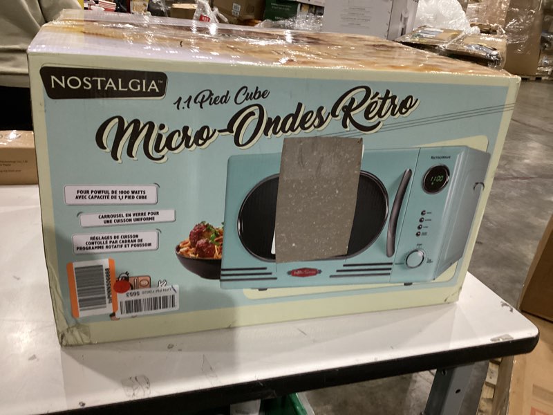 Condition photo showing New/Like New for Nostalgia NRMO11AQ6A 1000 Watt Power Retro Countertop Microwave Oven Easy to Clean with Removable Glass Turntable-Child Safety Lock-12 Programs-Digital Clock, 1.1 Cu Ft, Aqua Retro Classic 1.1 Cu. Ft. Aqua