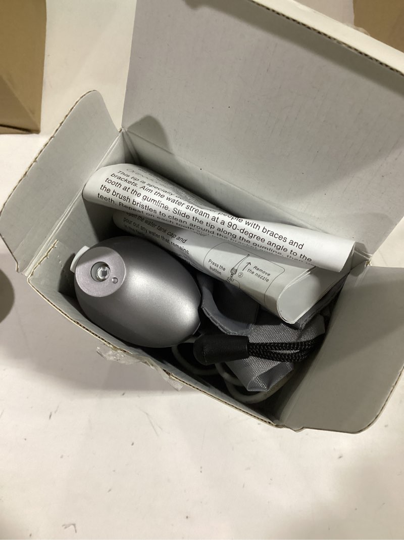 Condition photo showing Good Condition for AquaSonic Water Flosser - Cordless Rechargeable Water Flossers for Teeth Cleaning - Waterproof Aqua Flosser, Portable Oral Irrigator for Dental Cleaning with 5 Jet Tips – Braces Home Travel Charcoal Metallic