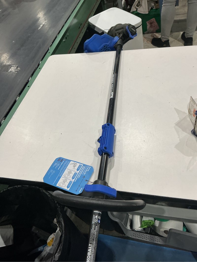 Condition photo showing As Is for kobalt quiet tech 24-volt 15-in straight shaft battery string trimmer 4 ah only tools