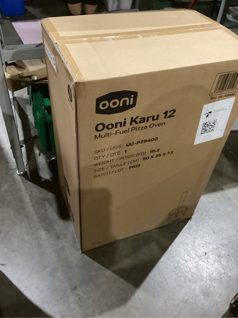 Condition photo showing New/Like New for ooni karu 12 multi-fuel outdoor pizza oven – 12 inch pizzas in 60 seconds - portable wood and gas fired pizza oven with pizza stone, dual fuel ooni pizza oven